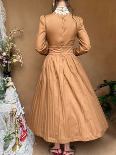 The price is for a dress only, others are not included.  Garment Size   	 		 			Size 			S 			M 			L 			XL 		 		 			Shoulders 			35 			37 			39 			40 		 		 			Bust 			84 			88 			92 			96 		 		 			Waist 			66 			70 			74 			78 		 		 			Full Length 			120 			121 			122 			123 		 		 			Sleeve Length 			59 			60 			61 			62 Vintage Fitted A-line Tea Length Dress, Classic Pleated Dress With Full Skirt, Classic Pleated Full Skirt Dress, Pleated Fit And Flare Midi Dress With Full Skirt, Fall Dresses With Gathered Full Skirt, Fall Dresses With Full Gathered Skirt, Fitted Solid Color Midi Dress With Pleated Skirt, Fitted Solid Color Pleated Midi Dress, A-line Midi Dress With Pleated Hem