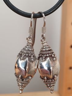 This is a pair of ear-rings bought by myself in Sri Lanka in the 1990's. I bought them to one day (now!) sell, and they have therefore never been worn. The quality of the Sri Lankan silver craftsmanship is in my opinion the very best there is. The quality of the silver Is high (I have had it tested in the past and it always came up above 92.5%, above the requirement to be classed as Sterling silver) and the intricate work of the very unique Sri Lankan style is a pice of history in itself. Throug Handmade Classic Silver Clip-on Earrings, Vintage Teardrop Earrings Stamped 925, Handmade Silver Clip-on Classic Earrings, Silver Handmade Classic Clip-on Earrings, Ornate 925 Stamped Silver Dangle Earrings, Vintage Teardrop Stamped 925 Earrings, Hallmarked Dangle Metal Earrings, Ornate 925 Stamped Drop Earrings, Hallmarked Metal Dangle Earrings