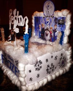 a frozen princess birthday cake with frosting and decorations