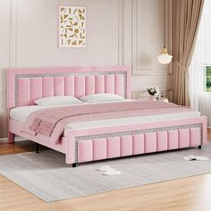 a pink bed sitting in a bedroom on top of a hard wood floor next to a window