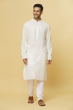 White kurta with mirror embroidery and side slits. Paired with pyjama.
Components: 2
Pattern: Embroidered
Type Of Work: Mirror
Neckline: Mandarin collar
Sleeve Type: Full
Fabric: Cotton
Color: White
Other Details: 
Concealed placket detailing
Slits
Occasion: Mehendi and Puja - Aza Fashions Mirror Embroidery, Men Kurta, White Kurta, White Mirror, Fashion App, Pyjama Set, Mandarin Collar, Aza Fashion, Fabric Cotton