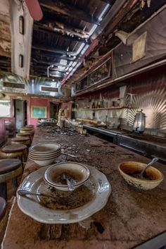 Abandoned Pink Diner Pink Diner, Abandoned Library, Apocalypse Landscape, Post Apocalyptic City, Old Abandoned Buildings, Apocalypse Aesthetic, Derelict Buildings, Bookshelf Art, Vintage Diner