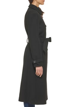 Finish off your cool-weather looks with this polished trench coat fixed with a faux-leather buckle on the finely stitched belt. 45" length Notched lapels Lined 52% wool, 46% polyester, 2% other fibers Dry clean Imported Black Fall Outerwear With Belt Loops, Fitted Pea Coat With Belted Cuffs For Fall, Black Belted Pea Coat For Fall, Black Belted Outerwear For Formal Occasions, Black Formal Outerwear With Belt, Modern Fall Outerwear With Belt Loops, Black Belted Outerwear For Fall, Formal Fall Outerwear With Belt, Office Long Coat With Belt Loops