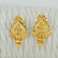 Celebrate the essence of Indian heritage with these radiant 22k gold earrings. Each earring is meticulously designed with traditional patterns that catch the light and add a regal touch to your look. Perfect for both festive occasions and elegant evenings, these earrings are a testament to the rich history of Indian jewelry, offering a blend of classic beauty and modern sophistication. 22k gold earrings handmade jewelry made in India Metal real gold, Purity 22k gold,  length is 2.2 centimeter an Festive 22k Yellow Gold Bridal Earrings, Gold Dual-tone Ceremonial Earrings, Gold Dual-tone Earrings For Ceremonial Occasions, 22k Gold Danglers With Intricate Design For Festivals, 22k Gold Danglers With Intricate Design For Diwali, 22k Gold Filigree Danglers, Festive 22k Gold Danglers With Intricate Design, Gold Plated Earrings With Intricate Design For Puja, 22k Yellow Gold Danglers With Intricate Design