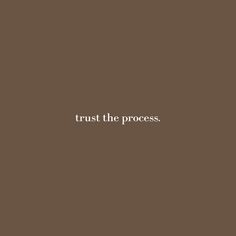 the words trust the process are written in white on a brown background with a black border