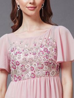 Sizes: To Fit Bust (in inches): XS(30), S(32), M(34), L(36), XL(38) To Fit Waist (in inches): XS(24), S(26), M(28), L(30), XL(32), 2XL(34) Pink embellished embroidered maxi dress Round neck Short, flared sleeve Sequined detail Maxi length in the flared hem Georgette fabric Zip closure Fabric: Georgette Pattern: Embellished Style: Maxi Dress For Women, Indian Dress, Indo-Western Dress, Fusion Outfits Occasion: Party Dispatch within 7 days. Festive Pink Embellished Embroidered Dress, Embellished Embroidered Short Sleeve Dress, Embroidered Embellished Short Sleeve Dress, Fitted Sequined Embroidered Festive Dress, Pink Embellished Embroidered Dress, Spring Embellished Embroidered Dress With Short Sleeves, Festive Short Sleeve Embroidered Dress, Festive Embroidered Sequin Dress, Fitted Embroidered Dress With Embroidered Neckline For Party