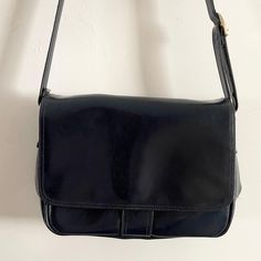 Description: Vintage Navy Blue Jane Shilton Clubhouse Leather Saddle Shoulder Bag . Adjustable Strap. Popper fastening. 5 Compartments Measurements: H: 23cm, W 34cm, Bag to Strap:  51cm Classic Blue Shoulder Bag With Detachable Strap, Classic Blue Shoulder Bag, Classic Blue Shoulder Bag For Business, Classic Blue Shoulder Bag For Travel, Retro Blue Bags For Formal Occasions, Blue Business Satchel, Classic Blue Crossbody Shoulder Bag, Blue Crossbody Satchel For Business, Blue Retro Shoulder Bag With Detachable Strap