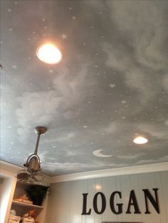 the ceiling is decorated with stars and clouds