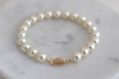 This classic timeless bracelet is the perfect accessory for any occasion.  Whether you are walking down the aisle or attending a special event this is a must have! Pearls never go out of style. It is hand beaded with Austrian crystallized pearls and finish off with a filigree fish hook clasp.  Clasp is sterling 14Kt gold filled. Available in silver in sterling silver. You can make this bracelet a dainty style by choosing 3-4mm pearls or bold with 8mm pearls.  Choose yours at checkout. Bracelet measures about 7 1/2" long but length can be customized.  Please leave your wrist measure at checkout.  A 7 1/2" bracelet will comfortably fit up to a 6 3/4" wrist leaving some room for movement. If you need a longer length please let me know. Pearls are available in different colors and sizes. Elegant Pearl Chain Beaded Bracelet For Formal Occasions, Elegant Pearl Bracelets For Anniversary, Elegant Pearl Chain Bracelet For Anniversary, Elegant Wedding Bracelets With Pearl Drop, Elegant Pearl Drop Bracelet, Elegant Pearl Bracelet With Pearl Drop For Anniversary, Elegant Wedding Bracelets With Pearl Chain, Elegant Pearl Chain Bracelets For Wedding, Elegant Pearl Chain Bracelet For Wedding