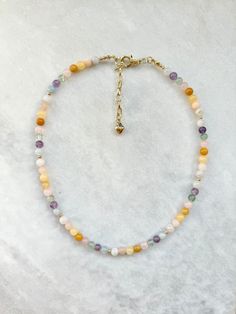 "Multi stone necklace featuring: * amethyst * jade * aquamarine * moonstone * rose quartz * fluorite * aventurine * butter quartz *  finished with gold plated spacer beads and 18k gold plated brass clasp with extender chain Necklace length approximately - 43cm / 17\" ( + 1.5\" extension) Please note that due to the fact these are natural stones the colours may vary with each necklace Keep away from water. Avoid direct contact with perfumes and chemicals. Remove before showering or swimming." Pastel Gemstone Beads Jewelry For Gifts, Pastel Jewelry With Colorful Beads As Gift, Pastel Jewelry With Colorful Beads For Gifts, Dainty Crystal Necklaces With Round Gemstone Beads, Pastel Round Beads Jewelry Gift, Adjustable Pastel Gemstone Beads Jewelry, Dainty Multicolor Gemstone Bead Necklaces, Dainty Multicolor Gemstone Beads Crystal Necklace, Dainty Multicolor Gemstone Beaded Necklaces