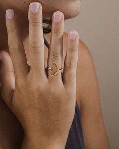 Want to capture the beauty of the moon and stars for yourself? This open ring is exactly what you need! This smooth, sleek ring is made of sturdy sterling silver. You'll be sure to shine just like a star when you're wearing this! Materials: 14K gold plated sterling silver or sterling silver Features: 1mm band, 4mm star, 17mm crescent moon, Lead & Nickel free, open band- allows for minor adjustments Minimalist Crescent Moon Charm Ring, Minimalist Adjustable Rings With Moon Charm, Minimalist Adjustable Ring With Moon Charm, Moonstone Open Ring With Moon Phase Detail, Dainty Jewelry Open Ring With Moon Phase, Gold Minimalist Rings With Moon Phase, Minimalist Gold Rings With Moon Phase, Dainty Moon Phase Open Ring Jewelry, Gold Minimalist Moon Phase Ring