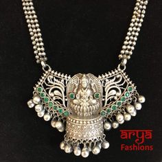 Siya Green Pendant German Silver Tribal Necklace Oxidized Luxury Ceremonial German Silver Necklaces, Temple Jewelry Style Locket Necklaces For Celebration, Celebration Temple Jewelry Necklace With Locket, Traditional Metal Necklaces For Celebrations, Metal Necklaces For Festive Occasions And Festivals, Metal Necklaces For Festivals And Celebrations, Festive Metal Necklaces For Festivals, Silver Necklaces For Navratri Celebration, Traditional Necklaces For Festivals