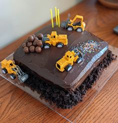 Chocolate cake, chocolate icing, cake "dirt", Whoppers "boulders" and construction vehicles on cake Construction Site Cake, Digger Cake, Construction Birthday Cake, Digger Birthday, Truck Birthday Cakes, Construction Cake, Mum Life, 3rd Birthday Cakes, 2 Birthday Cake