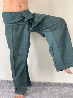 "Unisex Thai fisherman pants. One size fits all. You can wear in many occasions, casual wear, yoga wear, relax at home, travel etc. If you are looking for some pants that you can wear everywhere, comfortable, relax and Easy to wear. Thai fisherman pants is Answer!! Nice gift for yourself or your lover One pocket on the side for storing your items such as wallets, mobile phones, etc Approx. Measurements: One size can fits most and 1 Pockets Waist around 51\" (Wrap Pants) Length 45\" Lower Leg 14\ Green Cotton Yoga Pants, Traditional Green Straight Pants, Green Yoga Trousers, Traditional Green Wide-leg Pants, Traditional Style Long Yoga Pants, Green Wide Leg Yoga Pants, Green Wide-leg Yoga Pants, Pantalon Thai, Ninja Pants