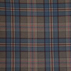 a plaid fabric with red, blue and grey colors is shown in close up view