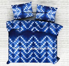 this is an image of a blue and white comforter set with matching pillow cases