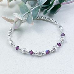 This elegant sterling silver bracelet featuring Amethyst Swarovski crystals makes the ideal gift for those who celebrate their birthday in February  February is represented in the Swarovski birthstone chart as Amethyst, a stunning deep purple crystal and symbolizes sincerity and happiness  The eclectic mix of beautiful beads are strung on high quality, strong, professional jewellers' elastic meaning there are no fiddly clasps to deal with, simply roll the bracelet over your hand, and onto your wrist The bracelet is elegantly presented in a grey faux suede jewellery pouch, complete with aftercare instructions and a cleaning cloth, adding to its charm as an ideal gift ☽ SIZE: Available in wrist sizes: Small (17cm), Medium (18cm) or Large (19cm) If you're unsure about sizing please drop me a Birthday In February, Birthstone Chart, Birth Stones Chart, Suede Jewelry, Jewellery Pouch, Birthstone Bracelet, Dainty Bracelet, Purple Crystal, Birthstone Bracelets