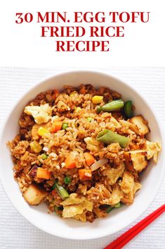 an egg fried rice recipe in a bowl with chopsticks next to it and the title overlay reads, 30 min egg tofu fried rice recipe