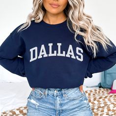 This Dallas sweatshirt is the perfect way to embrace the iconic Dallas skyline. Crafted with premium materials, this cozy Dallas crewneck offers both comfort and a touch of casual style. Whether you're taking in the city's impressive architecture, enjoying local attractions, or simply expressing your love for Dallas, our Dallas shirt is the ideal choice. Ideal for most situations, a unisex heavy blend Texas crewneck sweater is pure comfort. These garments are made from polyester and cotton. This combination helps designs come out looking fresh and beautiful. The collar is ribbed knit, so it retains its shape even after washing. There are no itchy side seams on these sweaters. - 50% cotton, 50% polyester - Medium-heavy fabric (8.0 oz/yd² (271.25 g/m - Loose fit - Sewn-in label Fit Note: If Dallas Cowboy Game Day Outfit, Fleece Sweatshirt For Fall Fan Apparel, Fall Fleece Sweatshirt For Fans, Relaxed Fit Fan Apparel Sweatshirt For Winter, Fan Apparel Sweatshirt With Ribbed Cuffs, Fan Apparel Long Sleeve Sweatshirt With Ribbed Cuffs, Trendy French Terry Tops For College, Fan Apparel Long Sleeve Sweatshirt For Fall, Varsity French Terry Crew Neck Sweatshirt