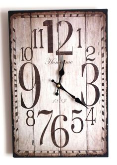 a wooden clock with numbers on it