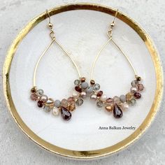 Anna always keeps you impressed and guessing with her creativity and edge! Our classic Anna earrings refreshed featured the movement of sculptural gemstones in a rainbow of colors atop the timeless hoop. Enjoy her everyday, for special occasions and everything in between! Length: 2″Featuring Garnet, Topaz, Smoky Topaz and Pearls. Elegant Multi-stone Hoop Jewelry, Elegant Multicolor Teardrop Hoop Earrings, Elegant Multi-stone Hoop Earrings, Elegant Multicolor Dangle Hoop Earrings, Elegant Multicolor Gemstone Hoop Earrings, Elegant Multicolor Hoop Jewelry, Elegant Multicolor Jewelry For Everyday, Elegant Multicolor Everyday Jewelry, Chocolate Jewelry