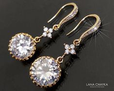 Crystal Cubic Zirconia Gold Chandelier Dangle Bridal Wedding Earrings. EARRINGS are about 1.49 inch (3.8cm) long from top of ear wire to bottom. BRIDAL EARRINGS SECTION: https://www.etsy.com/shop/LanaChayka?ref=seller-platform-mcnav§ion_id=11638940 BRIDAL JEWELRY SETS SECTION: https://www.etsy.com/shop/LanaChayka?ref=seller-platform-mcnav§ion_id=25839214 BRIDAL NECKLACES SECTION: https://www.etsy.com/shop/LanaChayka?ref=seller-platform-mcnav§ion_id=11638944 Elegant and timeless, these gorgeous e Round Crystal Wedding Earrings, Round Crystal Bridal Earrings For Wedding, Gold Round Crystal Earrings For Wedding, Dazzling Gold Chandelier Earrings For Wedding, Elegant Round Bridal Earrings, Round Crystal Earrings With Prong Setting For Wedding, Elegant Round Chandelier Earrings For Wedding, Diamond White Round Bridal Earrings For Wedding, Diamond White Round Bridal Earrings