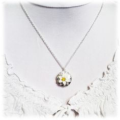 "Handcrafted Easter Lily Locket Necklace featuring hand sculpted white flower and a filigree backdrop on a shiny silver tone locket. -Locket : 2cm (approx. 3/4 inch) silver-plated locket -Interior Locket (for photo) : 13mm (1/2 inch) -Cable Chain : Choose silver plated or upgrade to 925 sterling silver -Length : Choose 16\" or 18\" cable chain View matching collection at: https://www.etsy.com/shop/strandedtreasures/search?search_query=easter+lily Flowers are hand sculpted without molds or paint Handmade Silver Flower Necklace For Anniversary, White Flower Pendant Jewelry Gift For Her, Sterling Silver Flower Pendant Locket Necklace, Sterling Silver Locket Necklace With Flower Pendant, Silver Flower Charm Necklace With Round Pendant, Sterling Silver Birth Flower Medallion Jewelry, Delicate Silver Medallion Necklace, Adjustable White Flower Pendant Jewelry, Delicate Silver Flower Charm Necklace