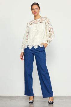 Crafted from embroidered open-eyelet lace, this long-sleeve blouse has lots of textural richness. It's got a floral motif woven in, creating a standout scalloped hem. The airy top features a round neckline and a back keyhole that's fastened by a loop button at the interior. •Round neckline •Long sleeves •Partially lined •Back keyhole with button •Relaxed fit Item Number: 45924 100% POLYESTER