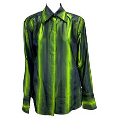 TheRealList presents: an electric green iridescent Gucci silk button-up shirt, designed by Tom Ford. From the Fall/Winter 1997 collection, this top was featured on the season's runway in multiple color variations and is one of Ford's more notable pieces during his early tenure at Gucci. This stunning top is constructed of iridescent silk with vertical stripes which glisten with every movement. Featuring a collar, button closure, exaggerated cone cuffs, and built-in shoulder pads, this shirt is a Gucci Classic Formal Shirt, Gucci Formal Collared Shirt, Tom Ford Runway, Gucci Blouse, Shoulder Pad Top, Gucci Menswear, Gucci By Tom Ford, Tom Ford Gucci, Gucci Brand