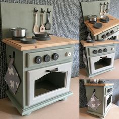 a green stove top oven sitting on top of a wooden counter next to a wall