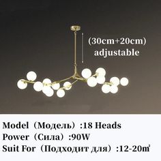 an image of a modern chandelier with white balls hanging from it's center