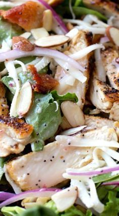 a salad with chicken, lettuce and onions