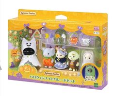 an assortment of toys in a box on a white background with japanese characters and pumpkins