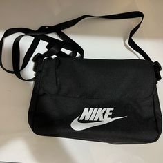 All Orders Ship 1-2 Business Days! Nike Cross Body Bag. Black With White “Nike” And Swoosh. Conditions: Like New/Clean/Good Condition/No Holes/No Stains/No Pilling/No Fade Never Worn Size: Os Trendy Nike Travel Bag, Nike Rectangular Everyday Bags, Nike Black Bags For Everyday, Nike Shoulder Bag For School, Nike White Everyday Bags, Nike Black Everyday Bags, Nike Shoulder School Bag, Nike School Bag With Adjustable Strap, Nike Casual Rectangular Bags