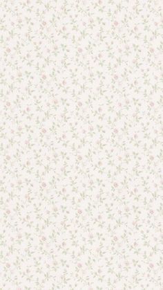 a white wallpaper with pink and green flowers on the bottom half of it,