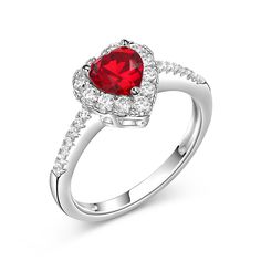 This exquisite ring perfectly portrays your love and commitment because it's designed with love in mind. This sweet design features a sparkling heart-shaped red center stone wrapped in a halo frames of smaller round stones. Additional stones adorn the shank to complete this elegant look. This engagement ring is a symbol of your everlasting love.Carat Weight: 3.1 ctStone Size: 8*8 mmStone Type: Jeulia® StoneNumber of Stones: 1 Stone Color: Ruby RedStone Shape: HeartCarat Weight: 0.795 ctStone Siz Red Heart-shaped Diamond Ring, Red Diamond Heart Ring For Anniversary, Red Heart Diamond Ring For Anniversary, Red Heart Shaped Diamond Anniversary Ring, Red Heart Ring With Center Stone, Heart-shaped Diamond Ring For Anniversary, Elegant Red Heart-shaped Diamond Ring, Heart-shaped Halo Jewelry For Valentine's Day, Red Heart Shaped Diamond Ring For Valentine's Day