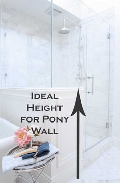 a bathroom with white walls and flooring has a sign that says ideal height for pony wall