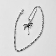 Sterling silver palm tree pendant with Italian box chain necklace, leaf necklace, boho necklace, rope necklace, tree necklace, silver necklace, 925 stamped **CHAIN AVAILABLE VARIOUS LENGTHS AND PRICES** Pendant Height: 20 mm  Chain Gauge: 1 mm Material: 925 Sterling Silver Tropical Necklace, Palm Tree Necklace, Palm Tree Pendant, Necklace Rope, Necklace Tree, Box Chain Necklace, Beach Necklaces, Tree Necklace, Tree Pendant