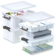 two plastic storage containers with dividers and drawers on each side, both filled with pens and pencils