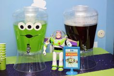 toy buzz lightyear from the movie toy story with plastic cups and magnets on table