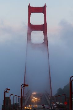 the golden gate bridge is surrounded by fog