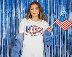 Show your patriotic pride with this customizable 4th of July Mom shirt. Personalize with your established year for a unique touch. Perfect for Independence Day celebrations and everyday wear. Patriotic Pre-shrunk Shirt For 4th Of July, Patriotic Shirt With Flag Print For 4th Of July, Patriotic Shirt With American Flag Print For Independence Day, Patriotic Shirt With American Flag For Independence Day, Patriotic American Flag Shirt For Independence Day, Patriotic Flag Print Shirt For 4th Of July, Patriotic American Flag Shirt For 4th Of July, Patriotic American Flag Shirt For Labor Day, Patriotic American Flag Shirt For Memorial Day