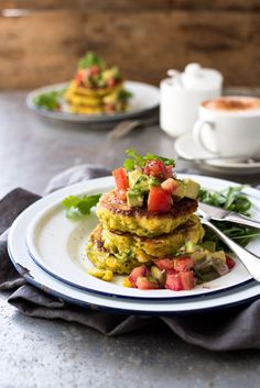 stack of pancakes with avocado, tomato and lettuce