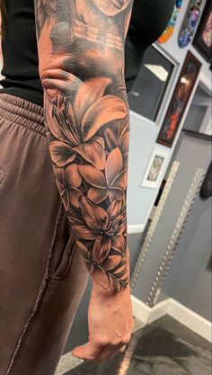 a person with a flower tattoo on their arm