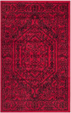 a red and black rug with an intricate design on the bottom, it is very soft