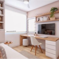 a room with a desk, shelves and a tv on the wall in it's corner