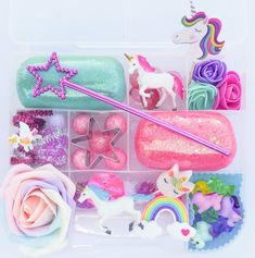 a plastic container filled with lots of different types of toys and decorations on top of a white surface