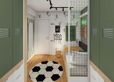 a room with green and white furniture and a soccer ball rug