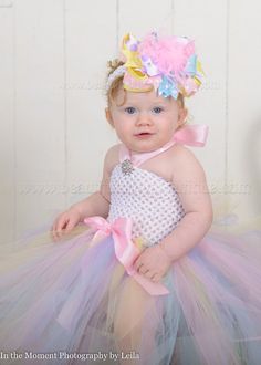 "This listing is for the Easter Pastel Tulle Tutu Dress in light pink, baby blue, pastel yellow, and lavendar with a satin halter tie as pictured in your choice of size. Matching Over the Top Bow and Headband set is optional. DETAILS: - double layered tutu for extra fluff - headband and bow are optional - 0- 6 months- 12\" length from top to bottom of dress - 6-12 months- 15\" length from top to bottom of dress - 12-24 months- 18\" length from top to bottom of dress Customize a beautiful baby, i Multicolor Tulle Tutu Dress For Easter, Easter Multicolor Tulle Tutu Dress, Cute Multicolor Tutu Dress For Easter, Fitted Pink Tutu Dress For Easter, Pink Fitted Tutu Dress For Easter, White Tulle Tutu Dress For Easter, Pink Tutu Dress For First Birthday And Easter, Pink Tutu Dress For First Birthday Easter, Multicolor Tutu Dress For First Birthday Spring Celebration