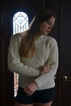 Absolutely stunning cable sweater in 100% wool. Made to order in your size, so please allow 4-8 weeks for the item to be hand knitted! Since it is 100% wool, it is a bit itchy, so please be aware of that when ordering.  Contact me for an acrylic option if you are allergic to wool!   Contact me if you need the sweater sooner than 4-8 weeks - we can knit it quickly for an additional fee.  Women's S: Finished Chest 40", Length 24 1/2" Women's M: Finished Chest 44", Length 25" Women's L: Finished Chest 48", Length 25"  Compare to a sweater that you like the fit of. Pictures show a size small sweater on a 38" chest, model is 5'8". Winter Fitted Cable Knit Pattern, Cozy Fitted Cable Knit Sweater, Wool Cable Knit Long Sleeve Pattern, Cozy Wool Cable Knit Pattern, Aran Sweaters, Aran Sweater, Small Sweater, Fisherman Sweater, Cable Sweater